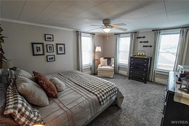 bedroom with ornamental molding, ceiling fan, and carpet flooring