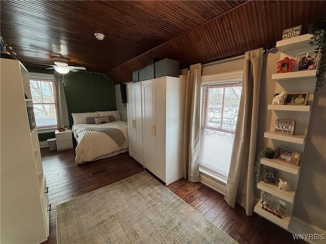 bedroom with wood ceiling, lofted ceiling, hardwood / wood-style floors, and multiple windows