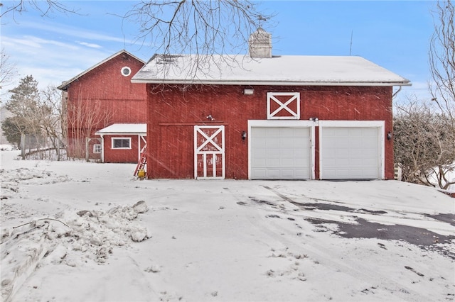 view of snow covered garage