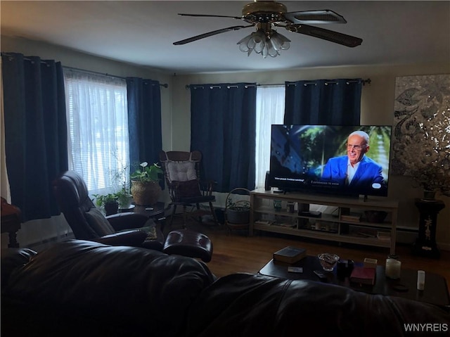 living room with hardwood / wood-style floors and ceiling fan