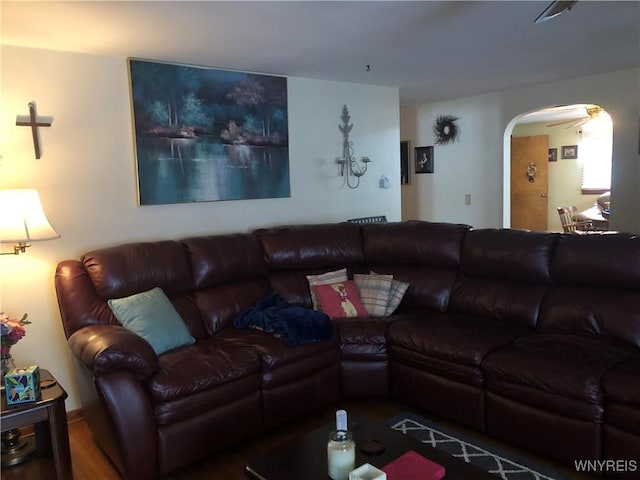 living room with arched walkways