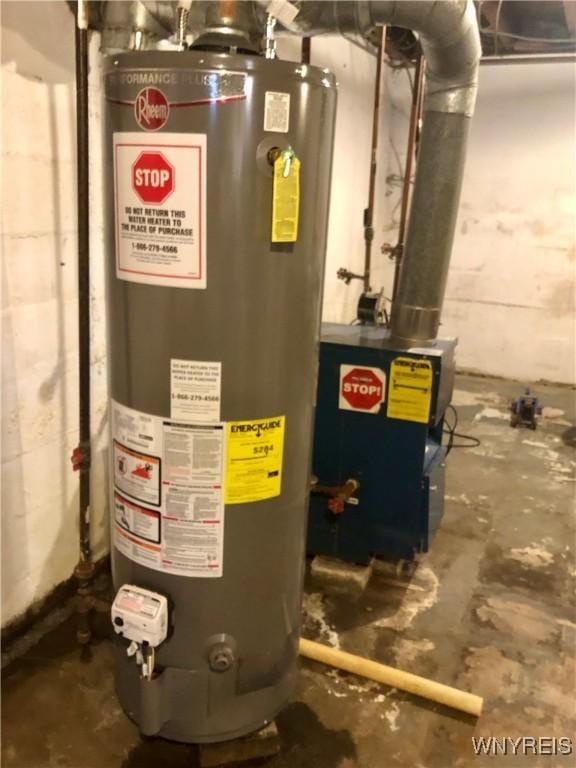 utility room featuring gas water heater