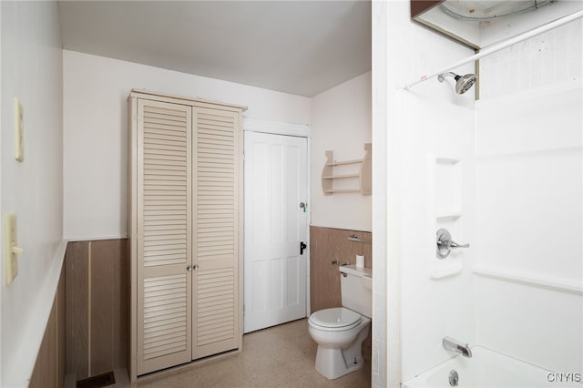 bathroom featuring toilet and tub / shower combination