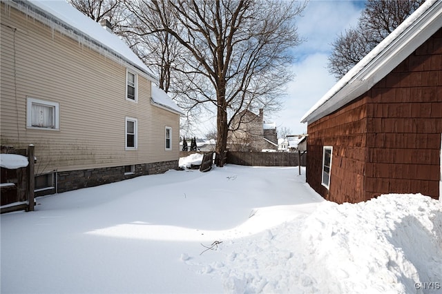 view of yard covered in snow