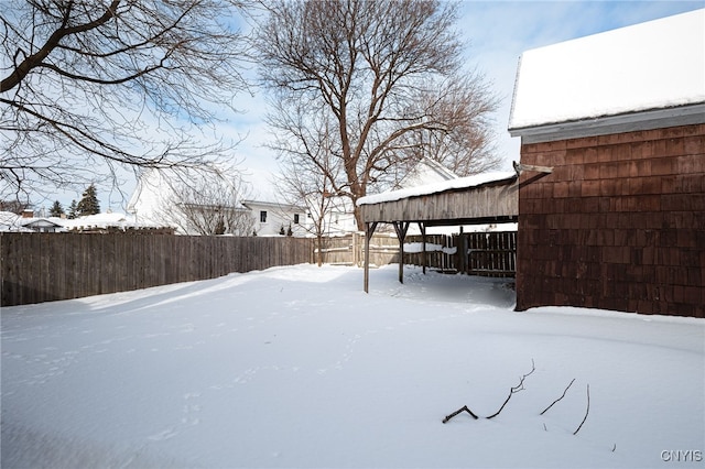 view of yard layered in snow