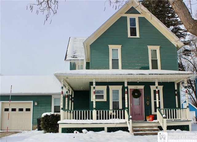 view of front facade featuring a garage and covered porch