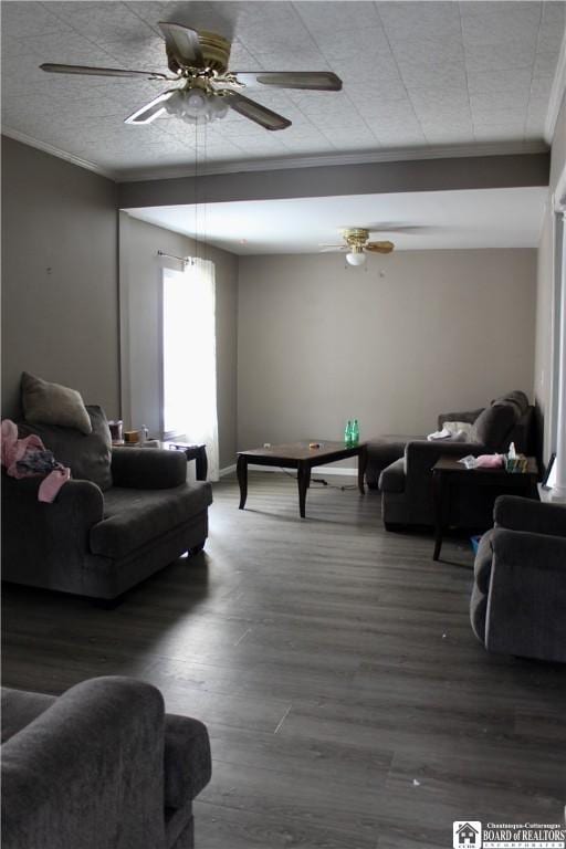 living room with ceiling fan, ornamental molding, and dark hardwood / wood-style flooring