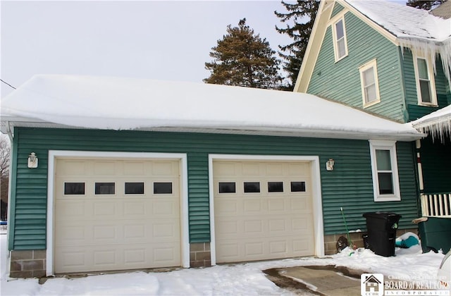 view of snow covered garage