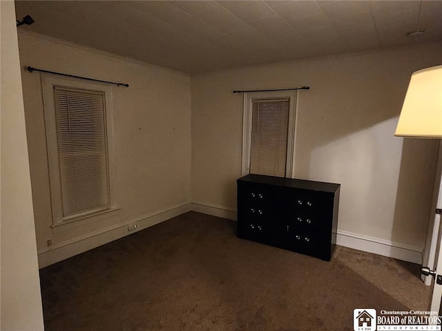 empty room featuring dark carpet