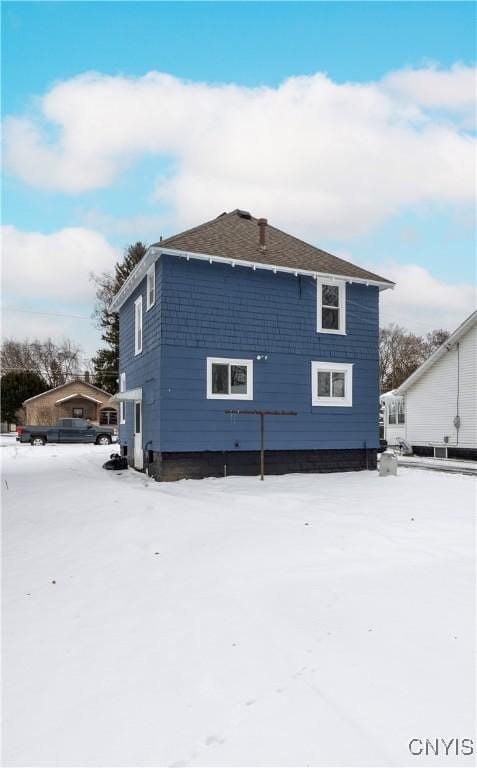 view of snow covered property