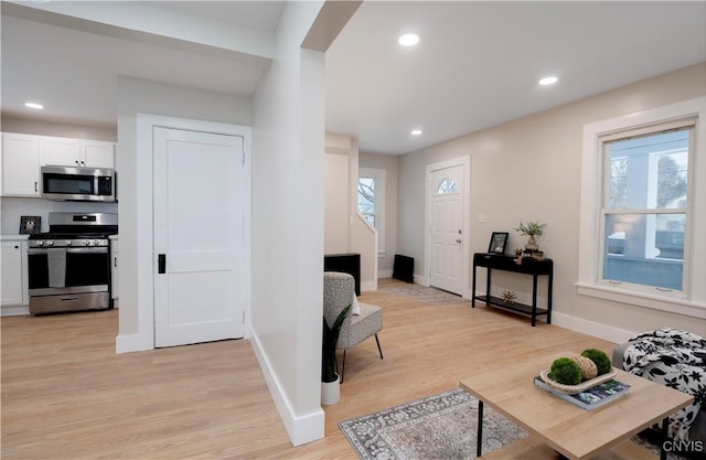 entrance foyer with light hardwood / wood-style flooring