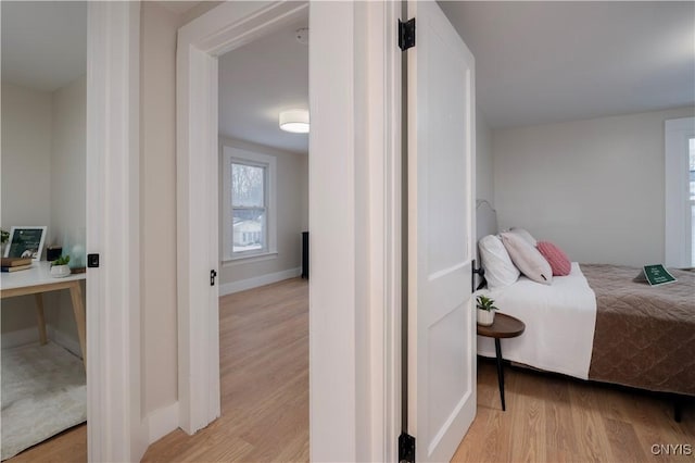 bedroom with light wood-type flooring