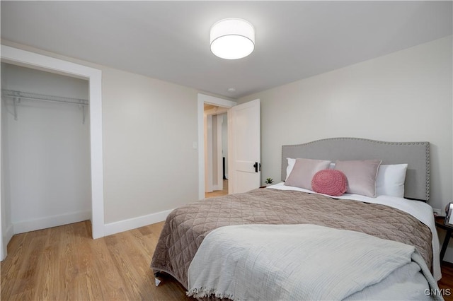 bedroom with a closet and light wood-type flooring