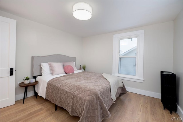 bedroom with light wood-type flooring