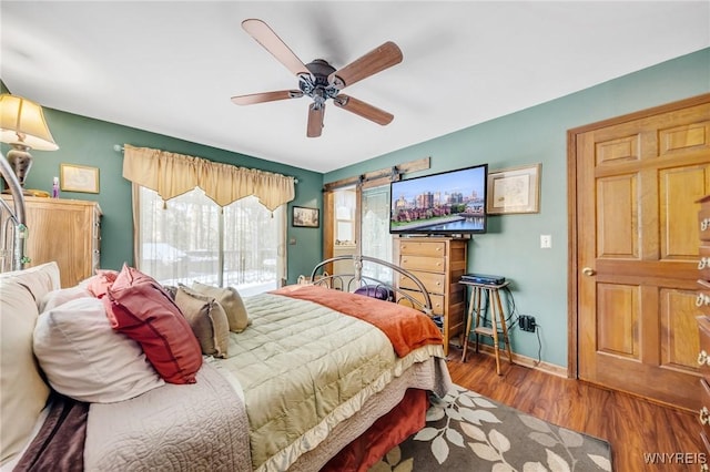 bedroom featuring hardwood / wood-style floors and ceiling fan