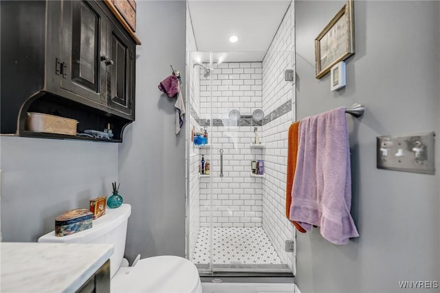 bathroom with vanity, toilet, and walk in shower