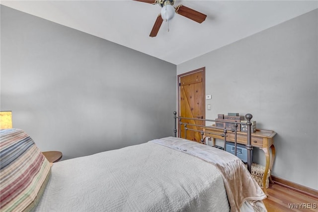 bedroom featuring ceiling fan and light hardwood / wood-style floors