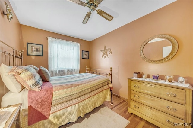 bedroom with ceiling fan and light wood-type flooring