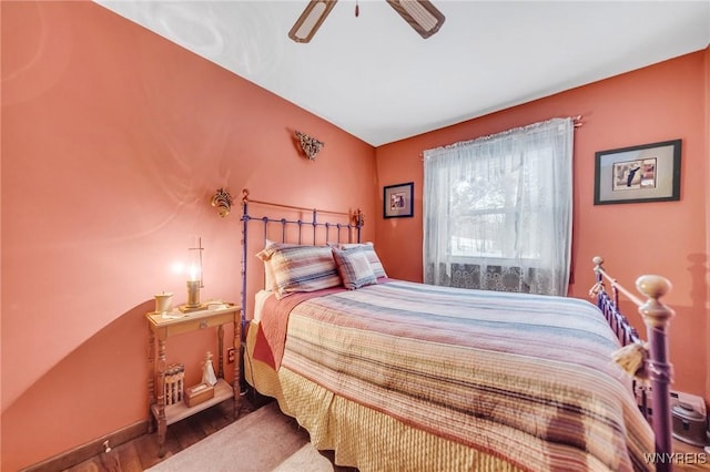 bedroom with hardwood / wood-style flooring and ceiling fan