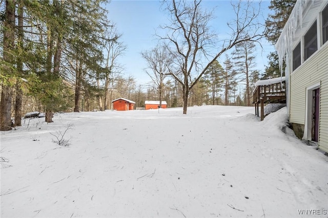 view of yard layered in snow