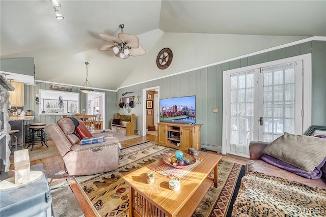 living room with hardwood / wood-style floors, high vaulted ceiling, ceiling fan, and baseboard heating