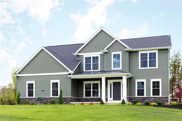 craftsman-style home featuring a front yard