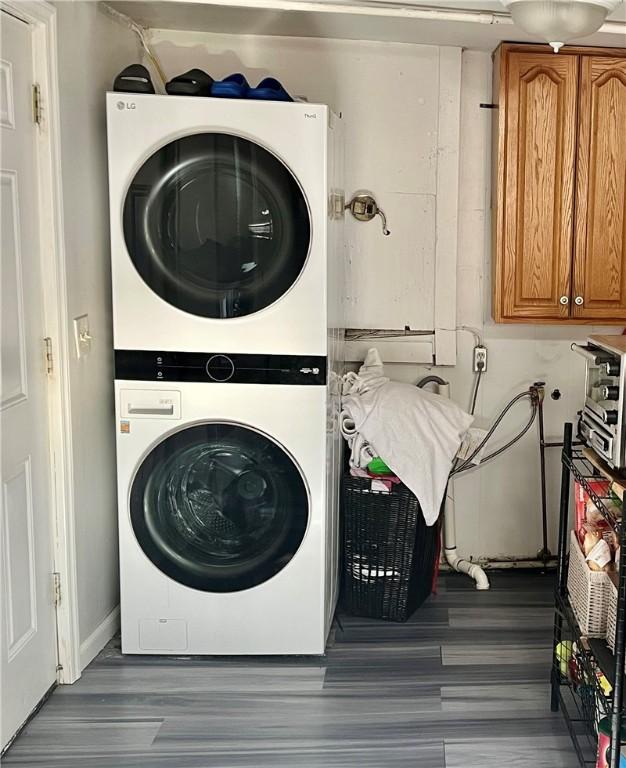 washroom with stacked washer / drying machine