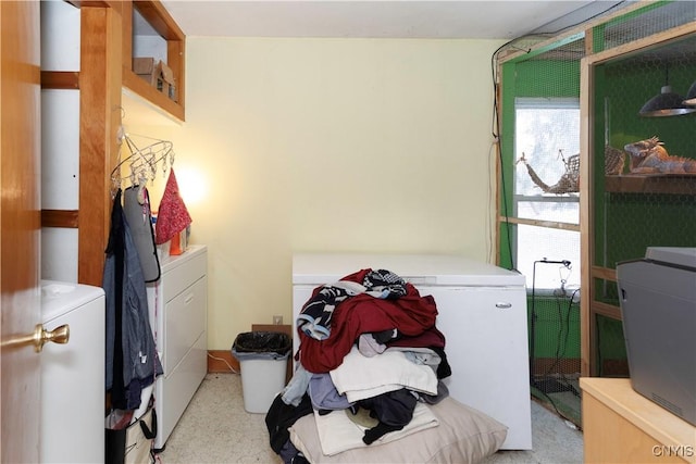 clothes washing area featuring light carpet and independent washer and dryer