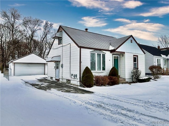 view of front of house with a garage and an outdoor structure