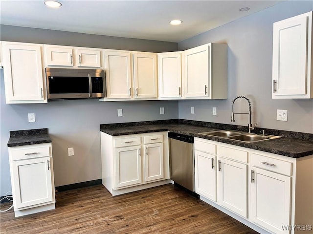 kitchen featuring white cabinetry, appliances with stainless steel finishes, and sink