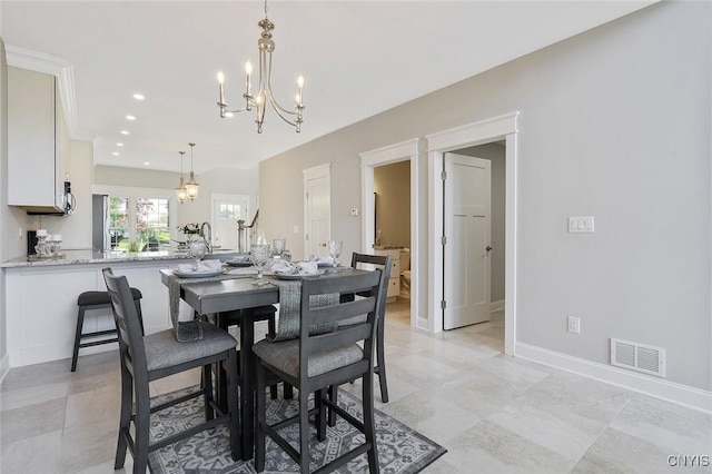 dining space with an inviting chandelier