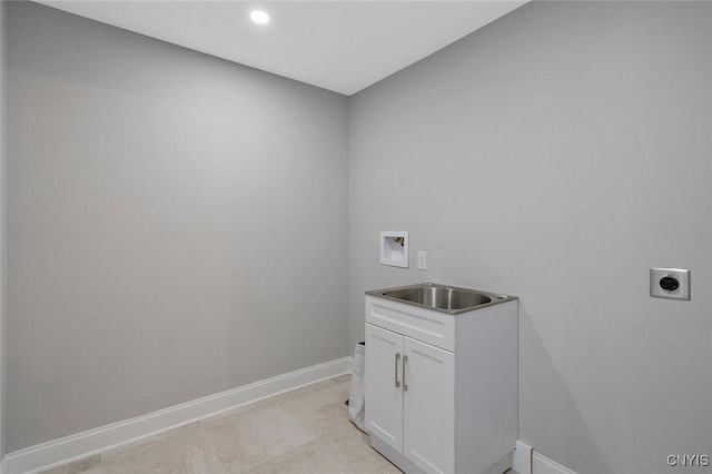 laundry room featuring electric dryer hookup, washer hookup, sink, and cabinets