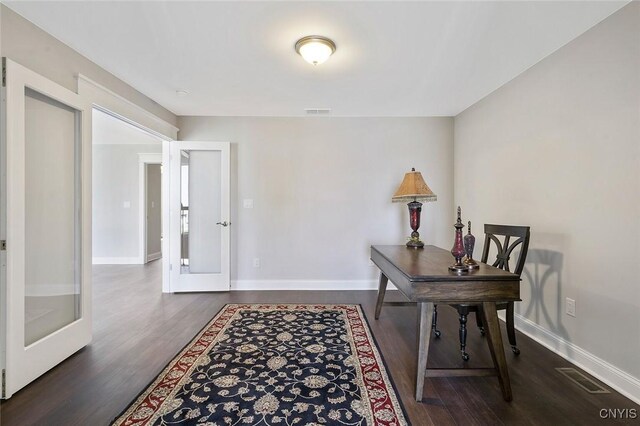 office area featuring dark wood-type flooring and french doors