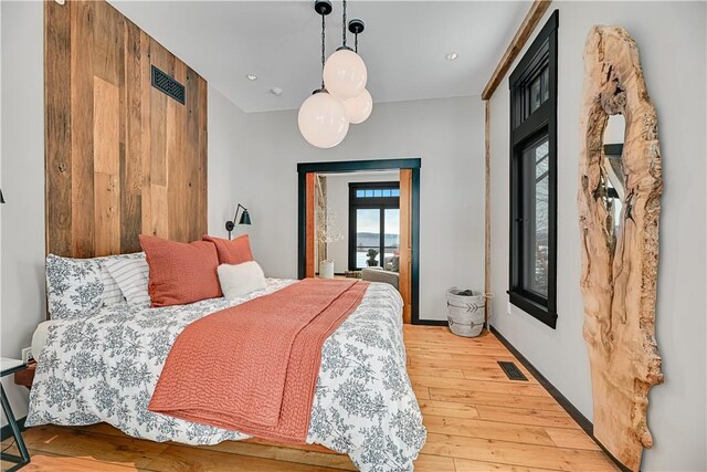 bedroom featuring recessed lighting, visible vents, and light wood-style floors