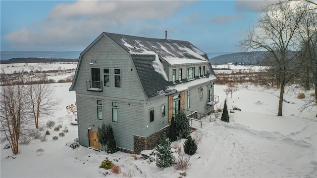 exterior space with a gambrel roof