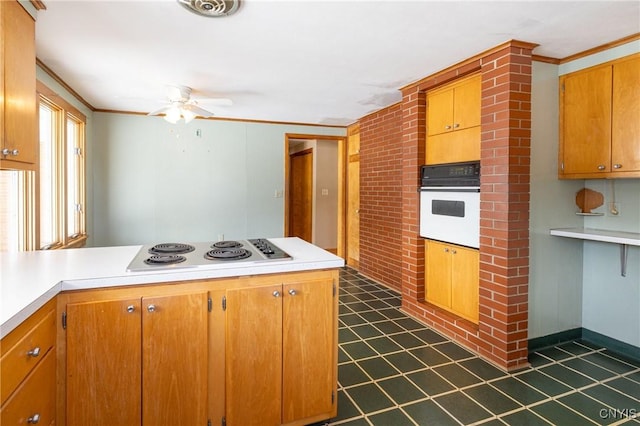 kitchen featuring crown molding, white appliances, brick wall, and ceiling fan