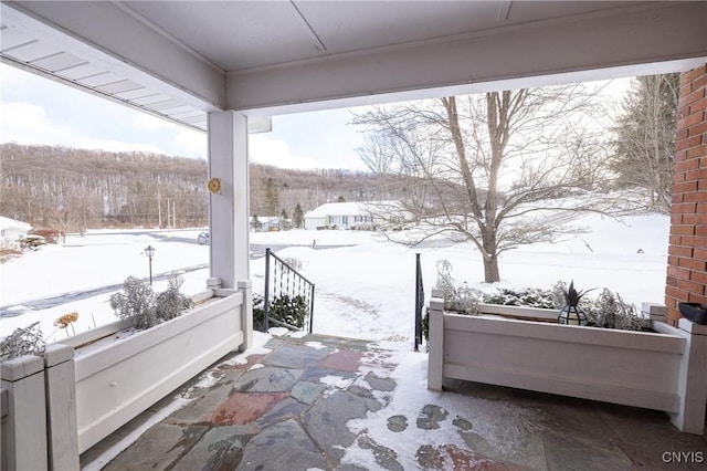 view of snow covered patio