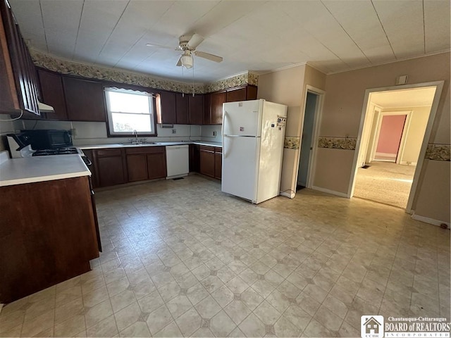 kitchen with sink, white appliances, ceiling fan, dark brown cabinets, and ornamental molding