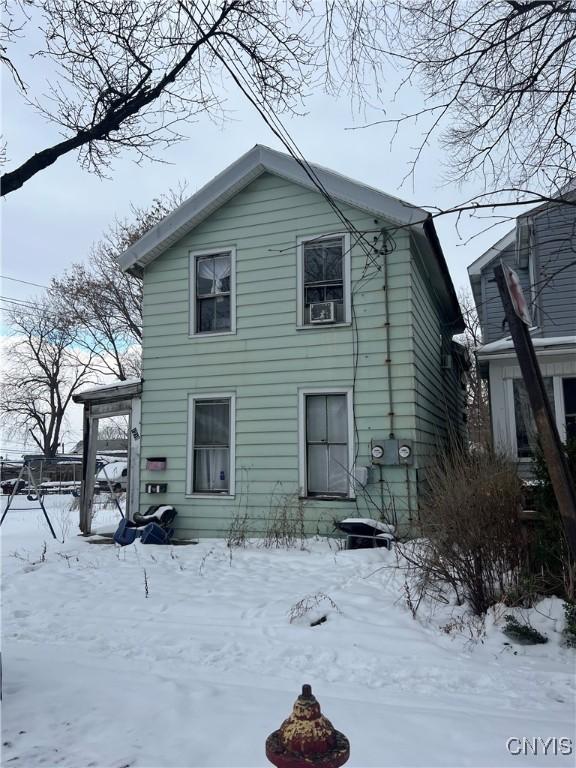 view of snow covered house