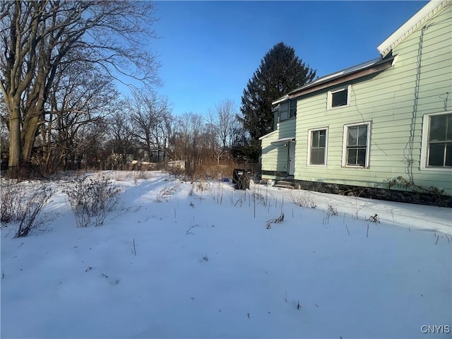 view of yard covered in snow