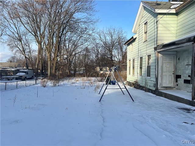 view of yard layered in snow