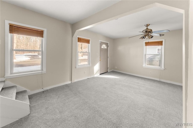 carpeted empty room with ceiling fan