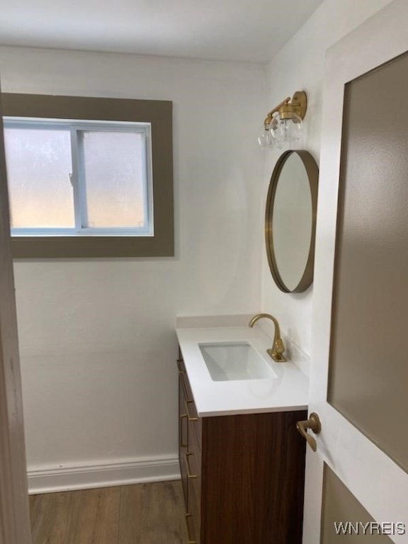 bathroom with vanity and hardwood / wood-style floors