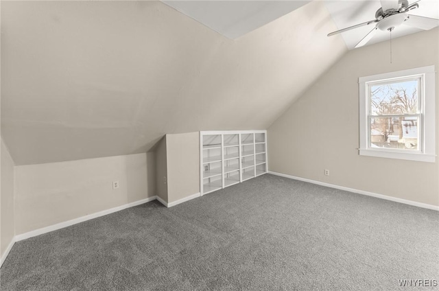 additional living space with ceiling fan, vaulted ceiling, and carpet