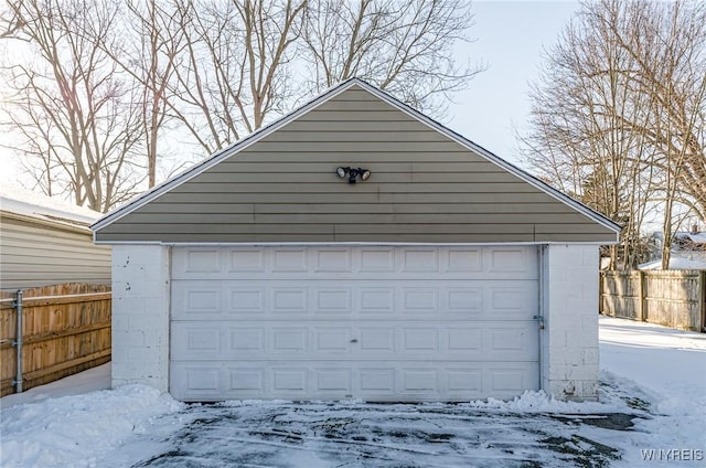 view of snow covered garage