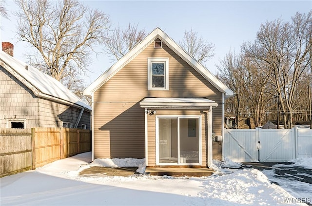 view of snow covered house