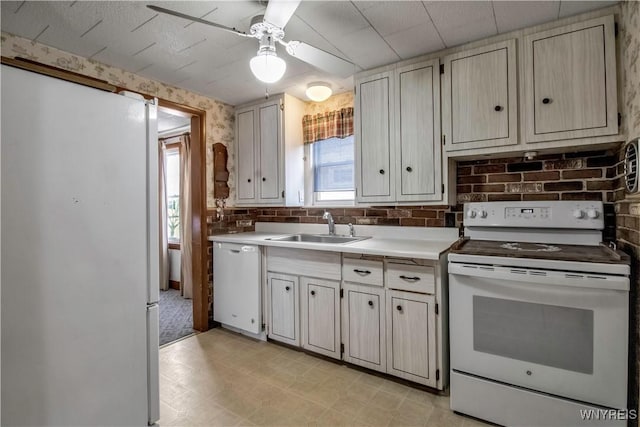 kitchen featuring sink, white appliances, ceiling fan, and backsplash