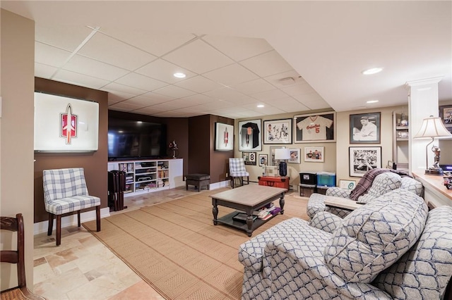 living room featuring a paneled ceiling