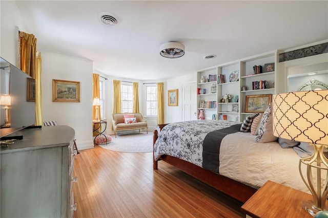 bedroom with light wood-type flooring