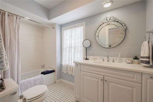 full bathroom with shower / tub combo with curtain, vanity, toilet, and tile patterned floors